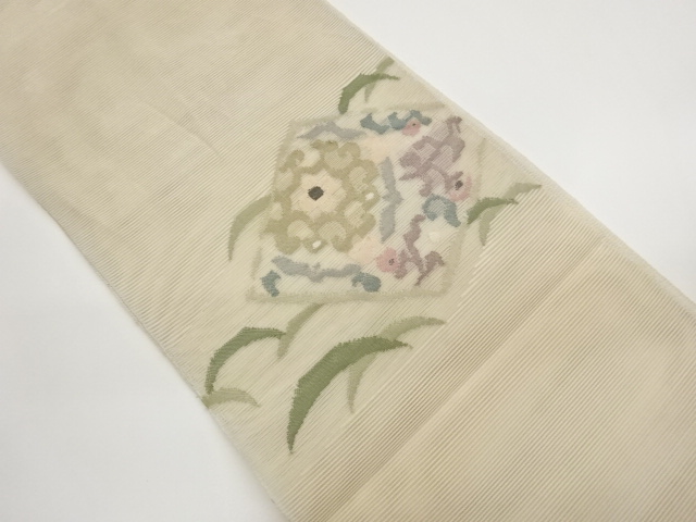 絽綴れ　華文に草花・芝模様織り出し名古屋帯